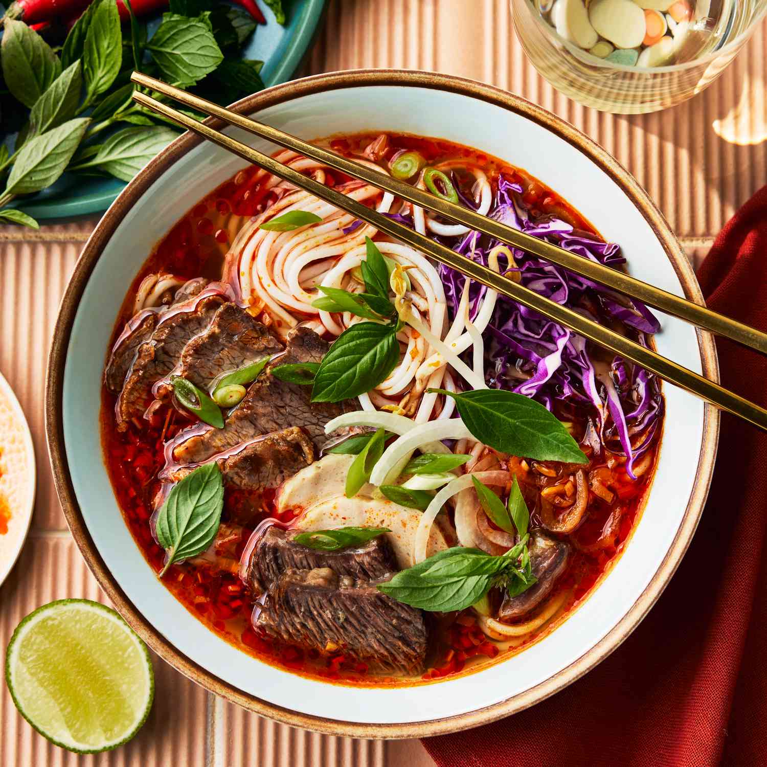 Asian beef noodle bowl with fresh herbs